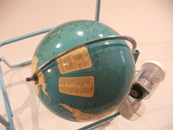 Paul Cullen, Geographer (2), 1995, metal chair, world globe, motor and electric cord. 700 x 800 x 600 mm. Image courtesy of the artist and Jane Sanders.