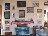 Wall of sea related images. Part of Stuart Shepherd's collection of folk art displayed at Te Aroha