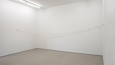 Ayse Erkmen, Inform, 2014, silver-plated metal, 100 x 4780 mm overall. Installation dimensions vary.