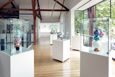 installation shot showing five glass works by Dominic Burrell, 2014