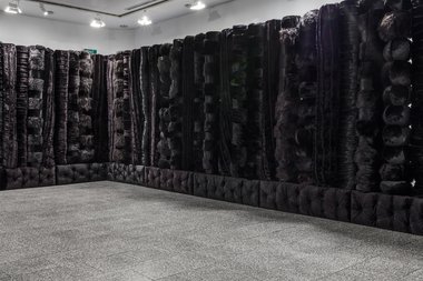 Kathy Temin, The Memorial Project: Black Wall, 2015  5.5 x 12.5 m x 2.95 m. As installed at the Gus Fisher Gallery. Image courtesy of the artist. Photo: Sam Hartnett.