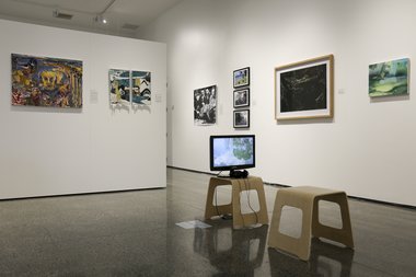 Estuary Art Awards 10th Anniversary, as installed in the Malcolm Smith Gallery. In the centre (on the floor) is the winning video work by Emily Parr, Te Wai Mokoia. Photo: Courtesy of Malcolm Smith Gallery. 