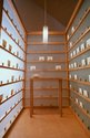 The Letter Writing Project, 1998. Mixed media interactive installation. Wooden booth, writing papers, envelopes  3 pieces, 290 x 170 x 231 cm each. Installation view at “Empathic Economies”, Davis Museum, Wellesley, 2000 Photo: Anita Kan