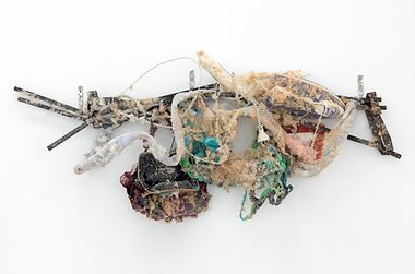 Alex Vivian, Entry level sculpture (things), 2015, metal fencing, iron, wire, handbag, clothing cut-offs, rust, flannelette, glue, paper, plastic plane, towel, synthetic fur, adhesive, 500 x 1200 x 250 approx. mm
