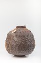 Wi Taepa, Mourning, c.1997, from Kauhuri Cultivation, anagama-fired red raku clay, harakeke cord, bone amulet. 330 x 330 mm. Collection of Garry Nicholas