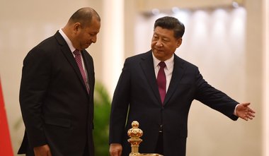 Tonga's King Tupou VI accepts the lead of Chinese dictator Xi Jinping during a visit to Beijing, March 2018. Photograph from the 'South China Morning Post.' 