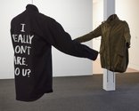 Deborah Rundle, Political Colours, 2018 (install view) black shirt with printed text, military patch and officers’ stars, khaki jacket with printed text, mannequin torso. Photo: Sam Hartnett