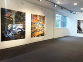 Installation image at Wallace Gallery--David Woodings: Only the Inescapable is Probable (2018). Orewa Carnival (2017). 1500 x 1800 mm. both oil on canvas