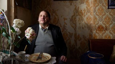 A still from Richard Billingham's Ray and Liz. The image shows Lol, played by Tony Way., 