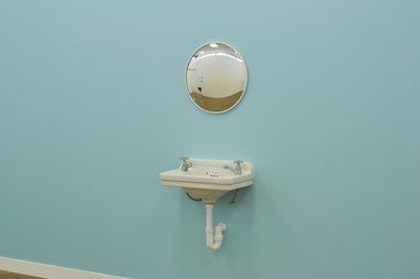 Severine Costa, Normative Utopia, 2019, neo-colonial “Edwardian” basin and taps, security mirror, Resene “half-Escape” blue wall. Image: Andreea Christache    